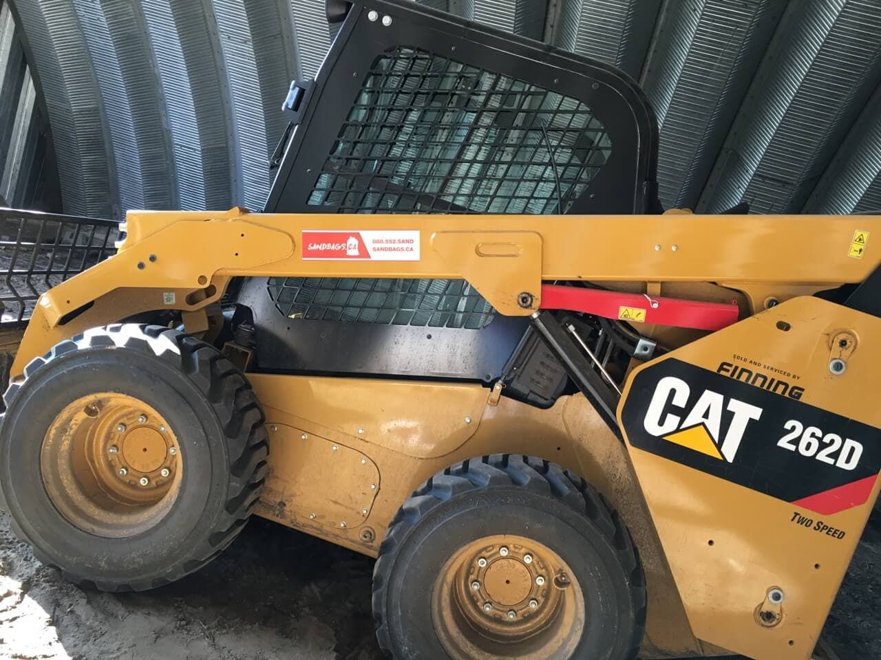 Skid steer parked inside the yard building